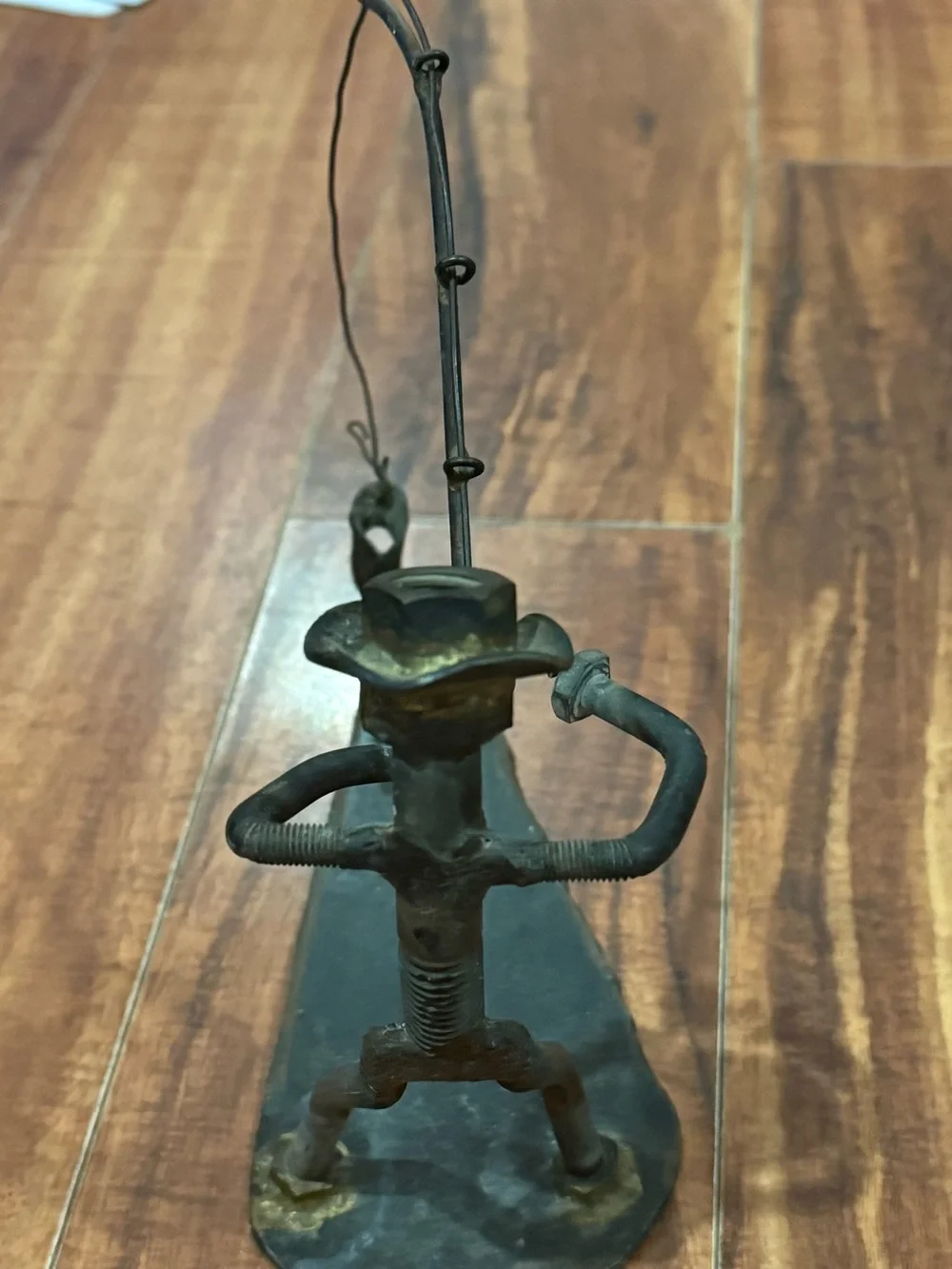 Industrial scrap metal sculpture fishing motif